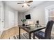 Well-lit office featuring a sleek glass desk, comfortable chair, and modern decor at 671 Brennan Dr, Decatur, GA 30033