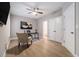 Bright office space featuring modern light fixture, neutral wall color, and black desk with stylish chairs at 671 Brennan Dr, Decatur, GA 30033