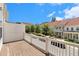 Relaxing deck with white railings and scenic neighborhood view under a blue sky at 671 Brennan Dr, Decatur, GA 30033