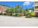 Beautiful condos sit behind a green landscape and brick entranceway along a quiet street at 671 Brennan Dr, Decatur, GA 30033
