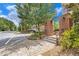 Landscaped brick entrance on a street corner with a community view of townhouses and mature trees at 671 Brennan Dr, Decatur, GA 30033