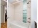 Updated bathroom featuring a shower-tub combo with tile surround and modern fixtures at 1101 Collier Nw Rd # P2, Atlanta, GA 30318