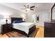 Well-lit bedroom with hardwood floors, ceiling fan, and ample natural light at 1101 Collier Nw Rd # P2, Atlanta, GA 30318