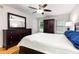 Inviting bedroom with hardwood floors, ceiling fan, dresser, and comfortable furnishings at 1101 Collier Nw Rd # P2, Atlanta, GA 30318