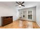 Bright bedroom with hardwood floors, ceiling fan, dresser, and natural light from two windows at 1101 Collier Nw Rd # P2, Atlanta, GA 30318