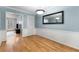 Light-filled dining area with hardwood floors and views into living area at 1101 Collier Nw Rd # P2, Atlanta, GA 30318