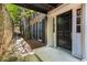 Exterior of the condo featuring a covered walkway, brick walls and a black front door at 1101 Collier Nw Rd # P2, Atlanta, GA 30318