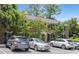 Well-maintained brick condominium with black shutters, lush landscaping, and convenient parking at 1101 Collier Nw Rd # P2, Atlanta, GA 30318