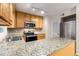 Updated kitchen featuring stainless steel appliances, granite counters, and tile backsplash at 1101 Collier Nw Rd # P2, Atlanta, GA 30318