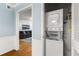 Convenient laundry closet featuring a stacked washer, dryer, and water heater at 1101 Collier Nw Rd # P2, Atlanta, GA 30318