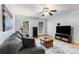 Comfortable living room with hardwood floors, gray sofa, and large television, perfect for relaxing at 1101 Collier Nw Rd # P2, Atlanta, GA 30318