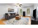 Inviting living room features a comfortable gray couch and a stylish blue and white rug at 1101 Collier Nw Rd # P2, Atlanta, GA 30318