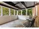 Charming sunroom with tile flooring, large windows, and comfortable seating at 1101 Collier Nw Rd # P2, Atlanta, GA 30318