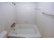 Bright bathroom features a tile shower-tub combination with updated fixtures at 1150 Collier Rd # K3, Atlanta, GA 30318