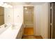 This bathroom includes a vanity with sink and a view into the tiled tub/shower area at 1150 Collier Rd # K3, Atlanta, GA 30318