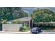 Exterior view of building with manicured landscaping, covered walkways, and nearby parking at 1150 Collier Rd # K3, Atlanta, GA 30318
