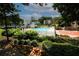 Community pool surrounded by greenery and lounge chairs, perfect for relaxation at 1150 Collier Rd # K3, Atlanta, GA 30318
