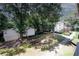 Scenic community view showcasing well-maintained landscaping, community grilling, and walking path at 1150 Collier Rd # K3, Atlanta, GA 30318
