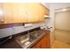 Updated kitchen featuring wood cabinets and modern appliances at 1150 Collier Rd # K3, Atlanta, GA 30318