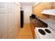 Galley kitchen featuring cabinets, hardwood floors, and modern appliances at 1150 Collier Rd # K3, Atlanta, GA 30318