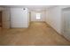 Spacious living room with carpet floors, bright lighting, and a sliding glass door at 1150 Collier Rd # K3, Atlanta, GA 30318