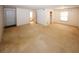 Cozy living room featuring carpet floors and ample natural light from the window at 1150 Collier Rd # K3, Atlanta, GA 30318