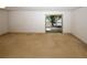 Spacious living room with carpet and access to outdoor patio, great natural light at 1150 Collier Rd # K3, Atlanta, GA 30318