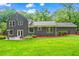 Backyard with patio, lawn and view of the back of the house at 261 Lamplighter Se Ln, Marietta, GA 30067