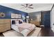 Stylish bedroom with dark blue accent wall, floral wallpaper, and elegant furnishings at 261 Lamplighter Se Ln, Marietta, GA 30067