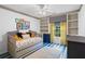 bedroom featuring a trundle bed, custom shelving and cabinets, as well as blue accents at 261 Lamplighter Se Ln, Marietta, GA 30067
