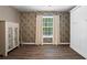 Bedroom featuring hardwood floors, built in storage, and a large window allowing natural light at 261 Lamplighter Se Ln, Marietta, GA 30067