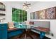 Sunlit breakfast nook featuring a glass table, cushioned seating, and views of the lush backyard at 261 Lamplighter Se Ln, Marietta, GA 30067