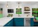 Updated kitchen featuring blue cabinets, stainless steel appliances and sleek countertops, exuding modern elegance at 261 Lamplighter Se Ln, Marietta, GA 30067