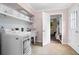 Well-organized laundry room with modern appliances, ample storage, and a convenient sink at 261 Lamplighter Se Ln, Marietta, GA 30067
