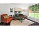Cozy living room with comfortable seating and a large window offering natural light at 261 Lamplighter Se Ln, Marietta, GA 30067