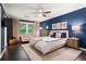 Bright main bedroom featuring hardwood floors, a ceiling fan, and beautiful decorations at 261 Lamplighter Se Ln, Marietta, GA 30067