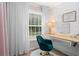 Well-lit home office featuring a built-in desk, stylish decor, and a comfortable chair at 261 Lamplighter Se Ln, Marietta, GA 30067