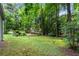 Large, grassy backyard with mature trees at 3754 Wyntuck Nw Cir, Kennesaw, GA 30152