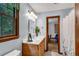 Bright bathroom with light blue walls, tile floors, and a window at 3754 Wyntuck Nw Cir, Kennesaw, GA 30152