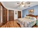 Bedroom featuring a door leading to the outside, hardwood floors, and neutral decor at 3754 Wyntuck Nw Cir, Kennesaw, GA 30152