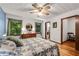 Bedroom with wood floors and view to bathroom and closet at 3754 Wyntuck Nw Cir, Kennesaw, GA 30152