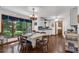 Charming dining room with large windows, a rustic chandelier, and comfortable seating for Gathering meals at 3754 Wyntuck Nw Cir, Kennesaw, GA 30152