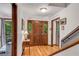 Hardwood floors and elegant trim around the front door and sidelights at 3754 Wyntuck Nw Cir, Kennesaw, GA 30152
