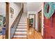 Welcoming entryway with hardwood floors, staircase, and views into other rooms at 3754 Wyntuck Nw Cir, Kennesaw, GA 30152