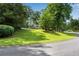 Serene home with large yard, lush trees, and well-maintained landscaping at 3754 Wyntuck Nw Cir, Kennesaw, GA 30152