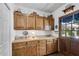 Functional kitchen with wooden cabinets and a cozy atmosphere, a great space for storage at 3754 Wyntuck Nw Cir, Kennesaw, GA 30152