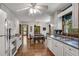 Well-lit kitchen providing a view into the dining room and ample counter space at 3754 Wyntuck Nw Cir, Kennesaw, GA 30152