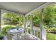 Screened-in porch with a table and chairs, offering a relaxing outdoor space at 3754 Wyntuck Nw Cir, Kennesaw, GA 30152