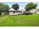 Spacious backyard featuring a well-maintained lawn and a dark deck, perfect for outdoor entertaining and relaxation at 3844 Sw Saddle Ridge Dr, Snellville, GA 30039