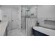 Modern bathroom with a soaking tub, glass-enclosed shower, and marble accents at 3844 Sw Saddle Ridge Dr, Snellville, GA 30039